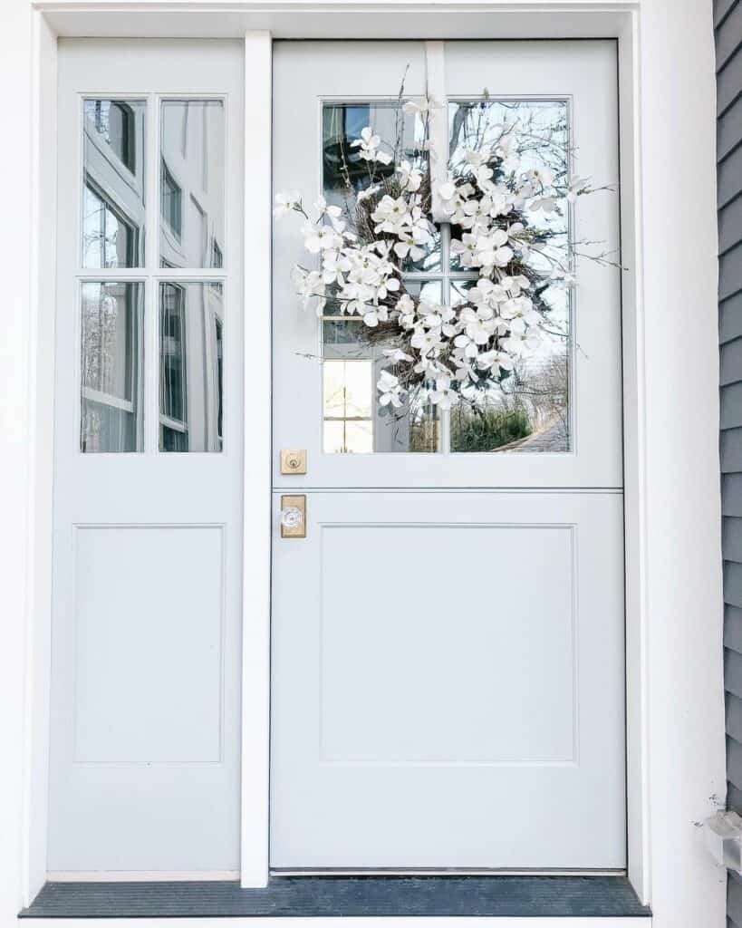 White Flower Spring Wreath on Light Gray Dutch Door