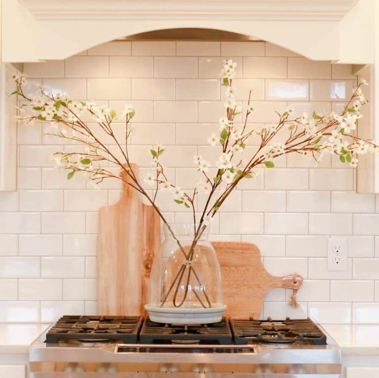 White Flowers and a White Tile Backsplash