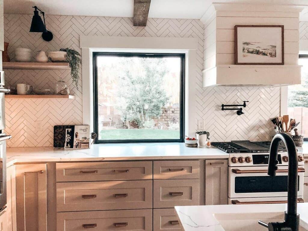 White Herringbone Tile Window Backsplash in Kitchen