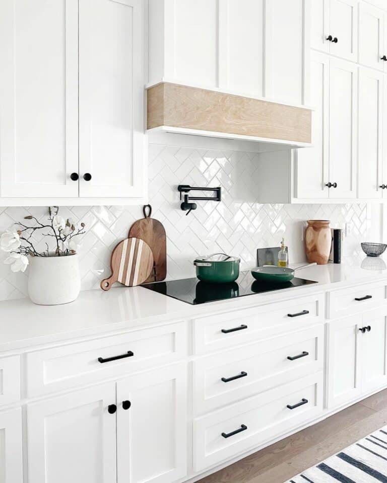 White Kitchen Cabinets With Wood and Black Accents