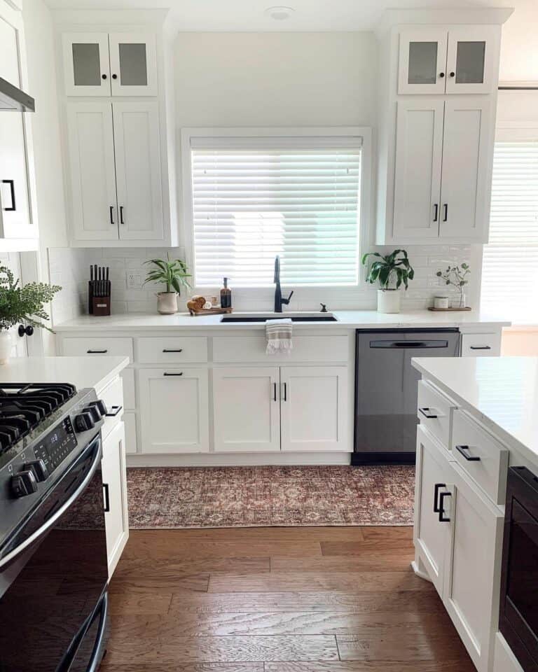 White Kitchen With Dark Cabinet Handles and Hardware