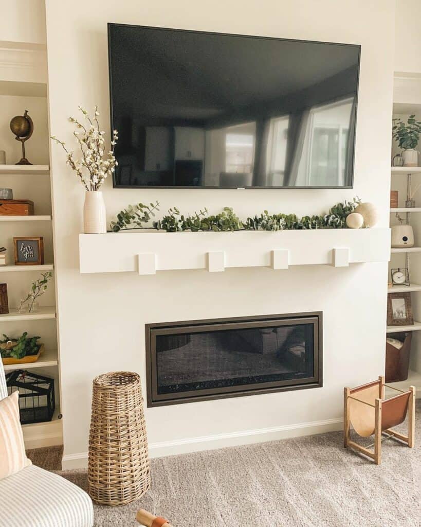 White Linear Fireplace Between Shelving Units