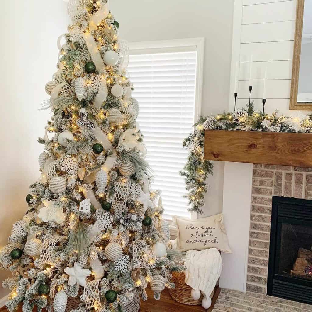 White Ornaments and a Burlap Ribbon on a Christmas Tree