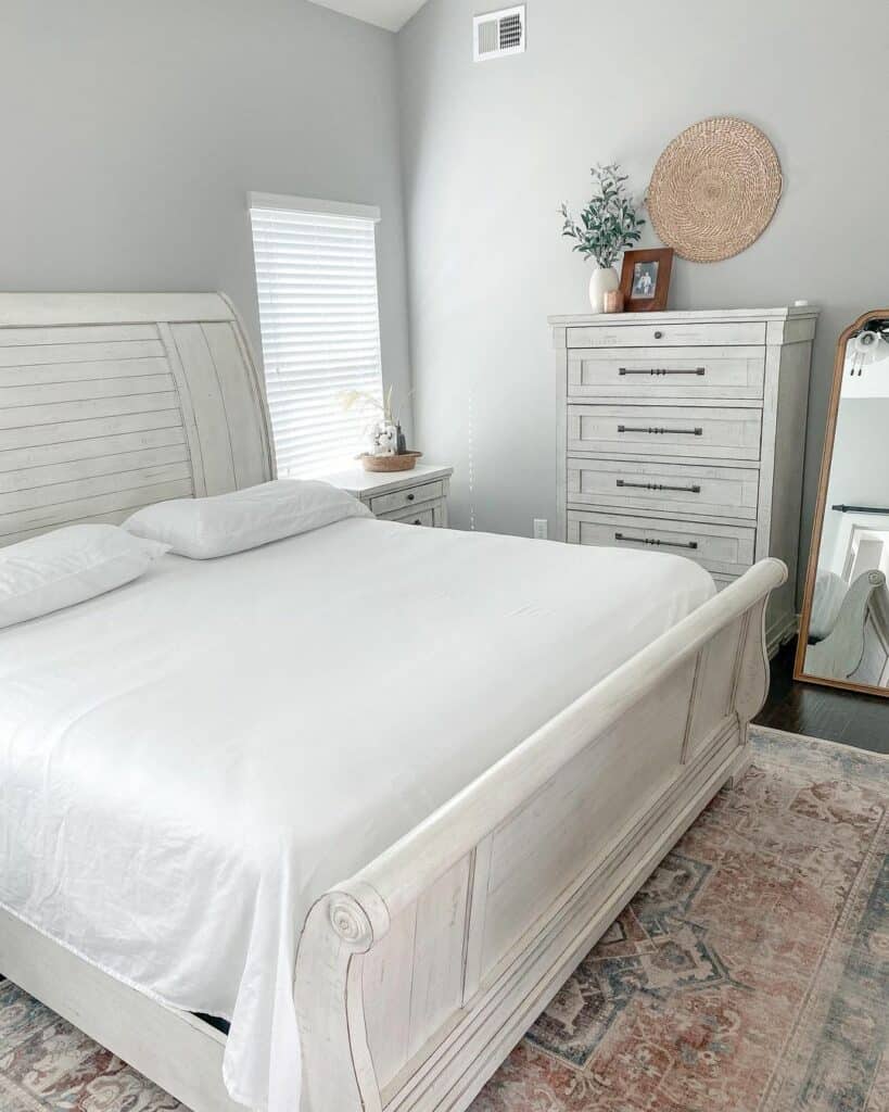 White Sleigh Bed in a Neutral Bedroom