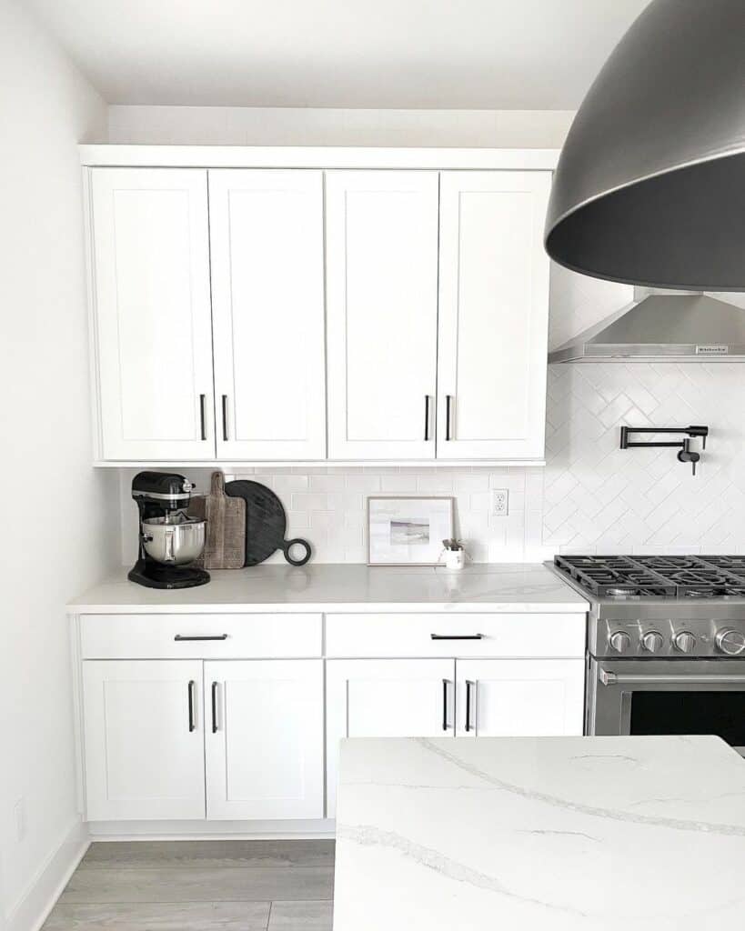 White Subway Tile Backsplash With Herringbone Accent Tile