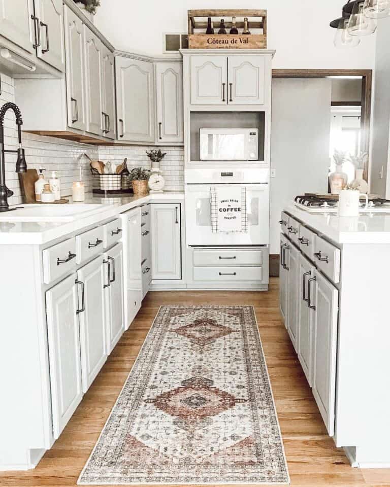 White Subway Tile Behind a Black Gooseneck Faucet