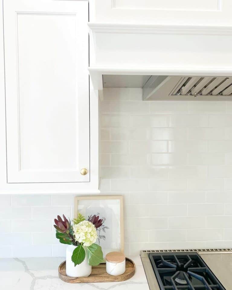 White Subway Tile Wall with Marbled Countertop