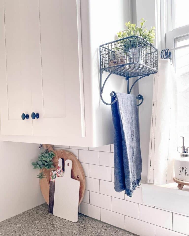 White Subway Tile and a Blue Towel