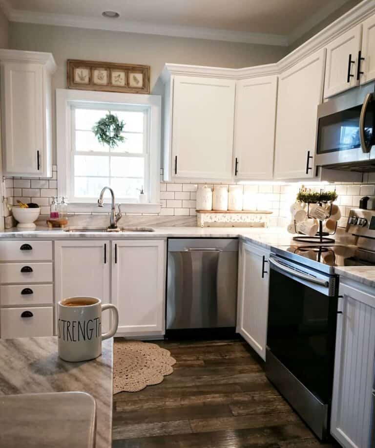 White Tile Backsplash and a Dark Wood Floor