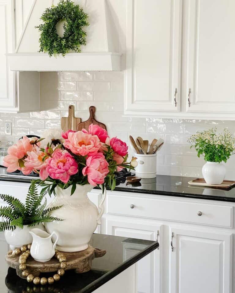 White Tile Backsplash with Black Countertop