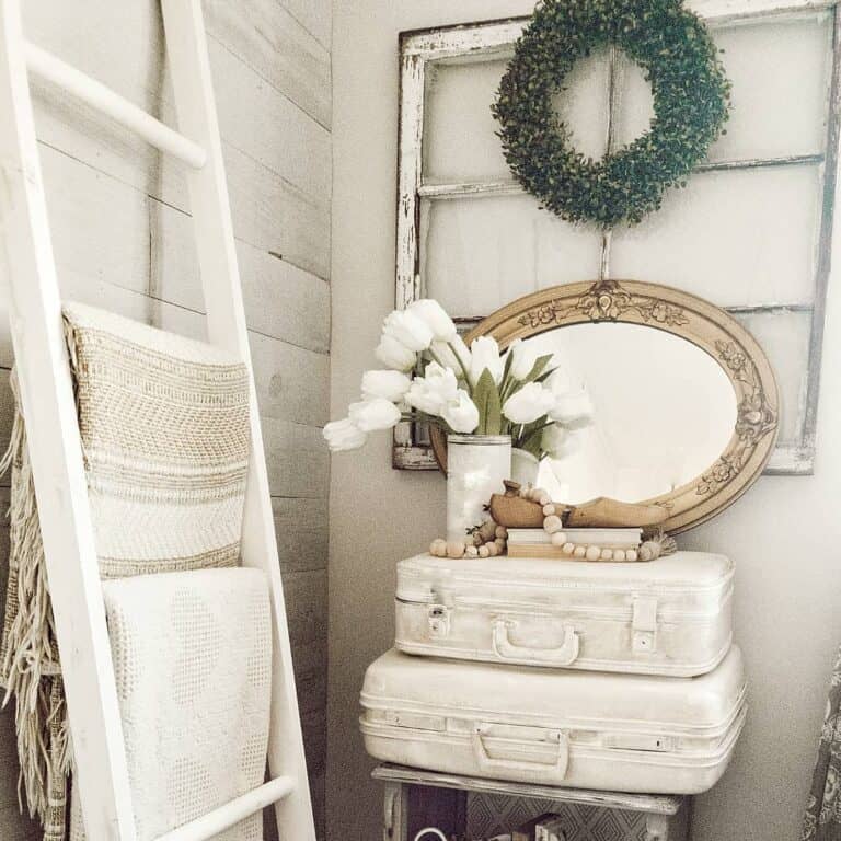 White Vintage Suitcases Tucked Into a Corner