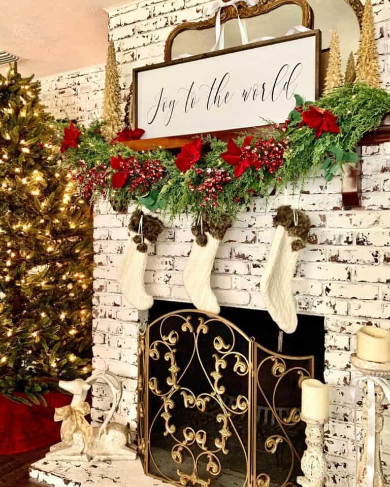 Whitewashed Brick Fireplace with Christmas Garland for Mantel