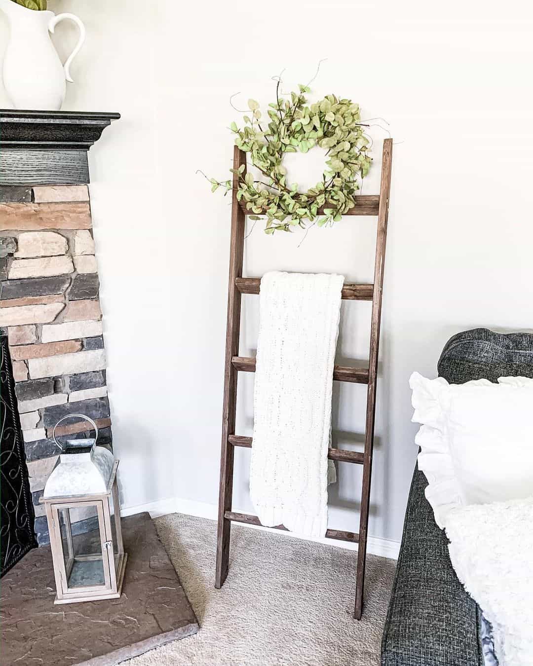 Wide wooden blanket ladder with white knit throw soul lane