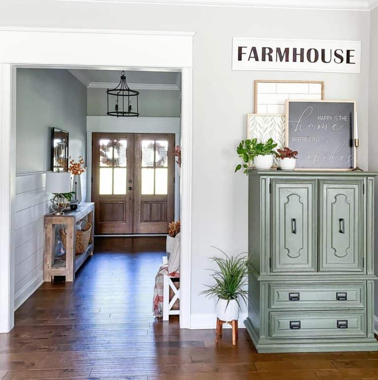 Wooden Double Doors Paired With Black Chandelier