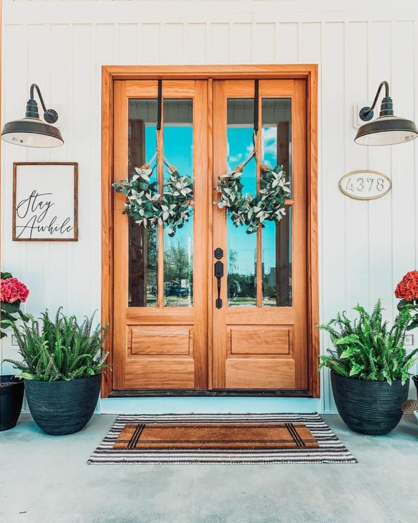 Wooden Double Front Doors with Green Spring Wreaths