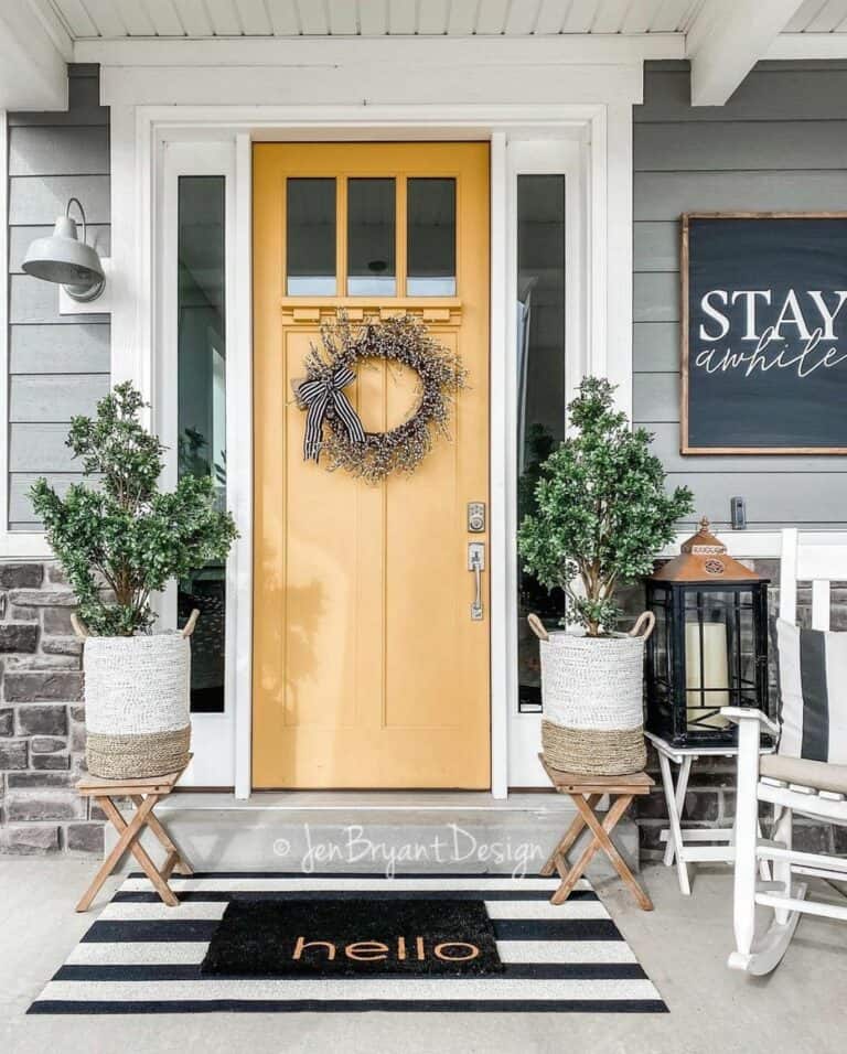 Yellow Front Door With White Berry Wreath