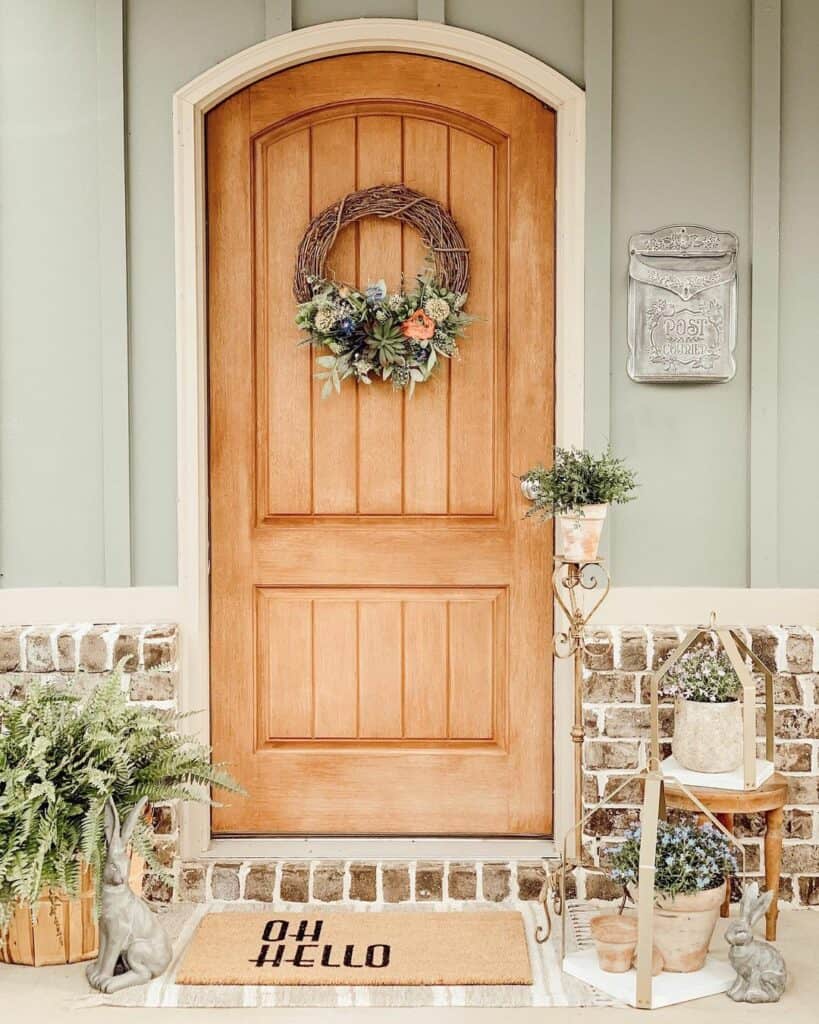 Arched Wood Door With Grapevine Spring Wreath