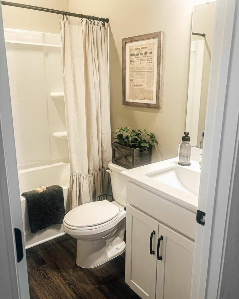 Basement Bathroom With Dark Hardwood Flooring