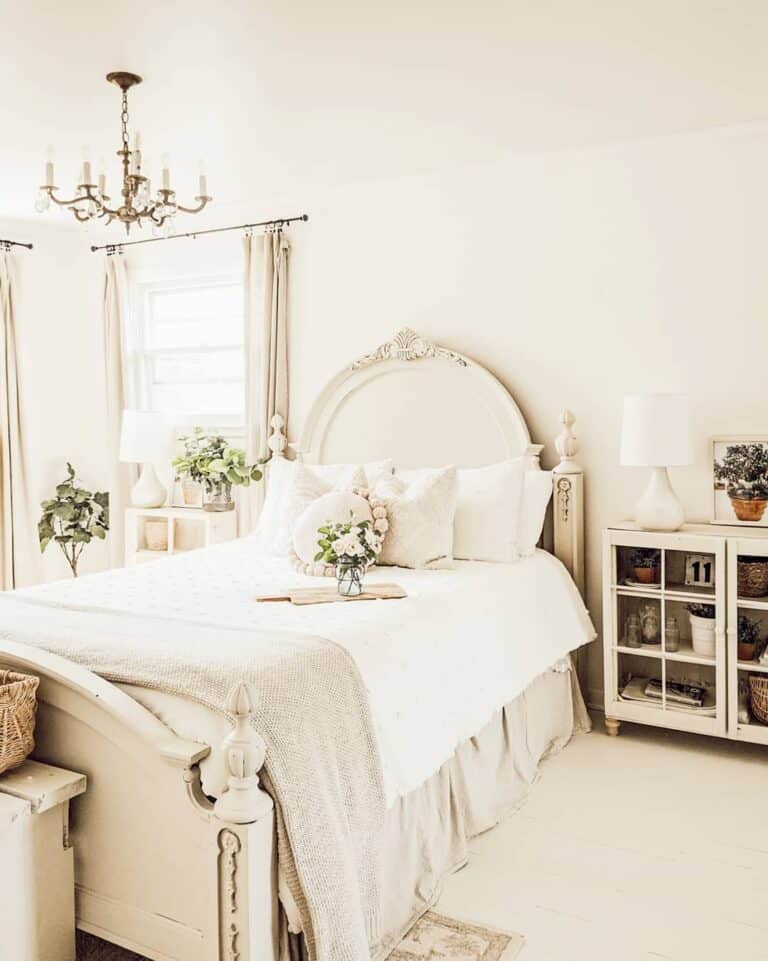 Bedroom With Gold Candelabra and Delicate Pink Flowers