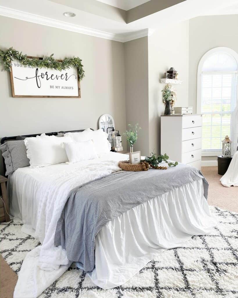 Bedroom With Green Garland on a White Sign