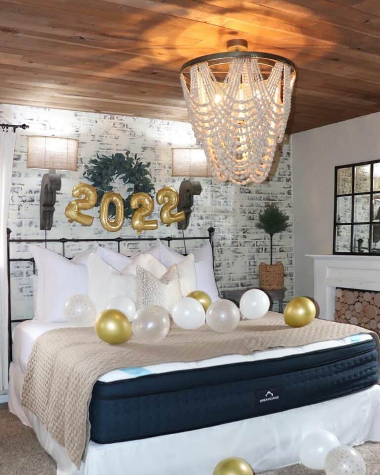 Bedroom With Wood Ceiling and Beaded Chandelier