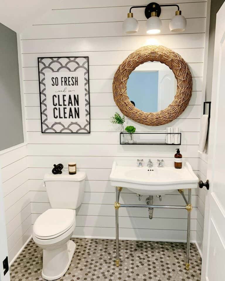 Beige and White Bathroom With Wicker Mirror