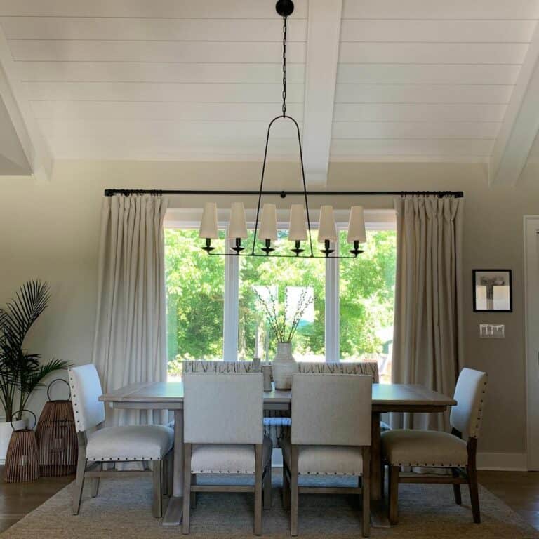 Black Chandelier and Off-white Curtains