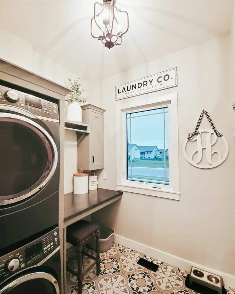 Black Countertop and an Ornate Tile Floor