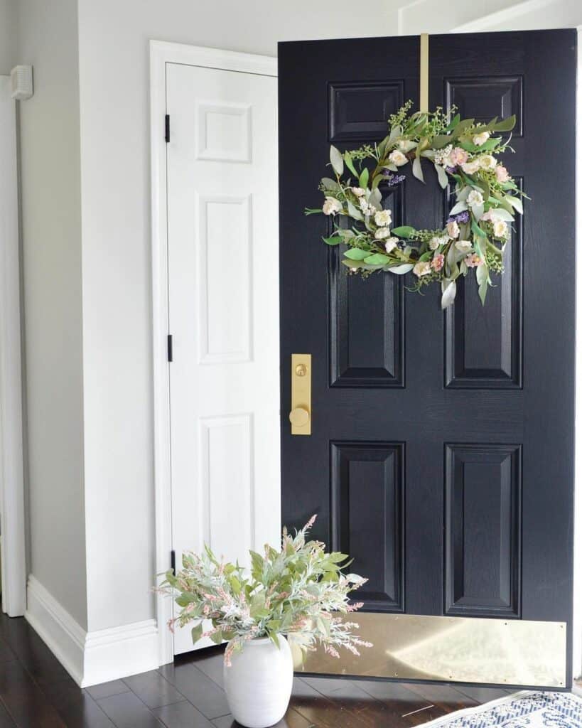 Black Entrance Door With Spring Wreath