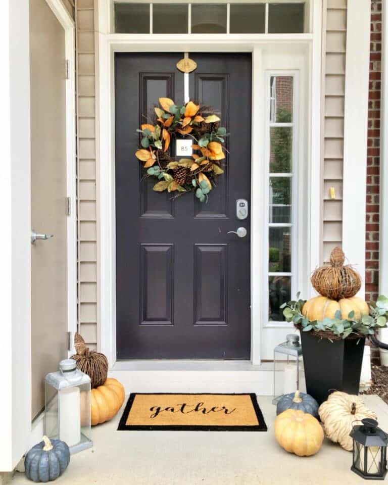 Black Entrance Front Door With Pumpkin Décor
