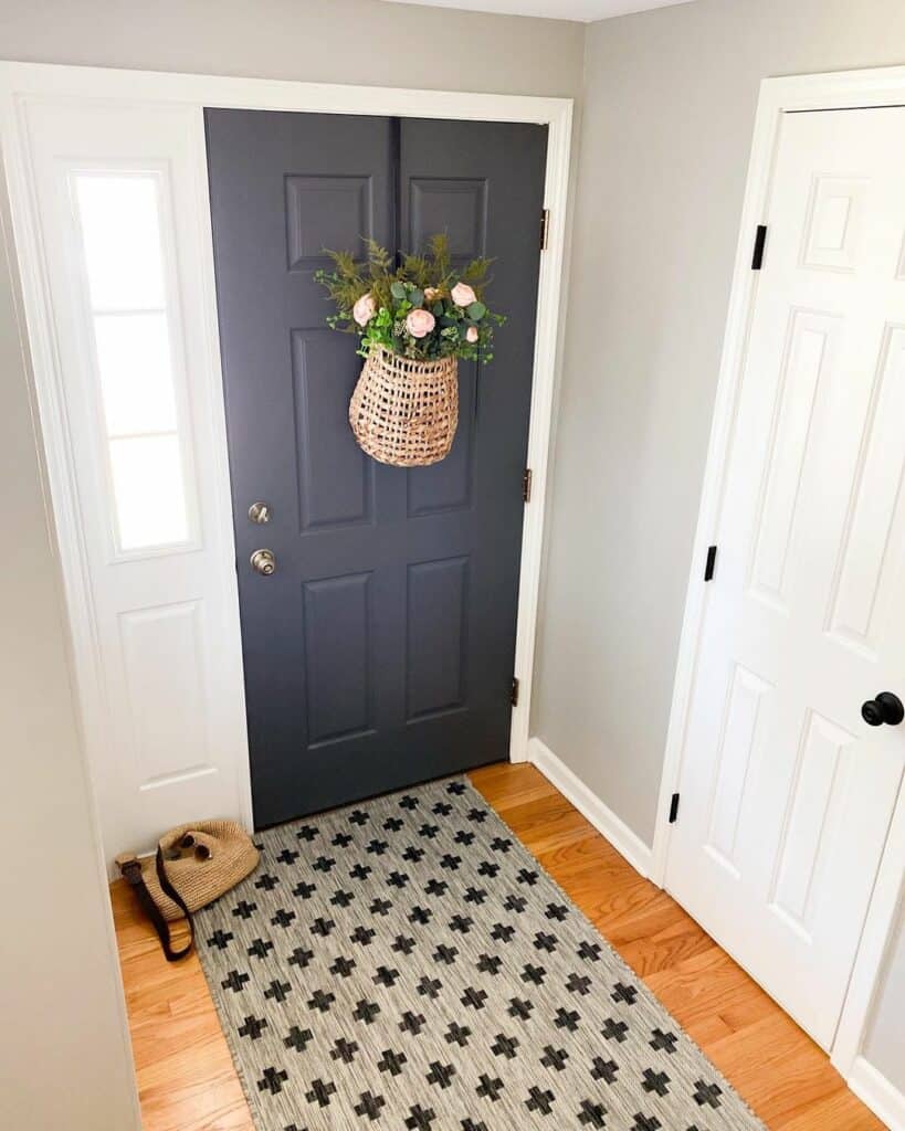 Black Front Door With Hanging Floral Basket