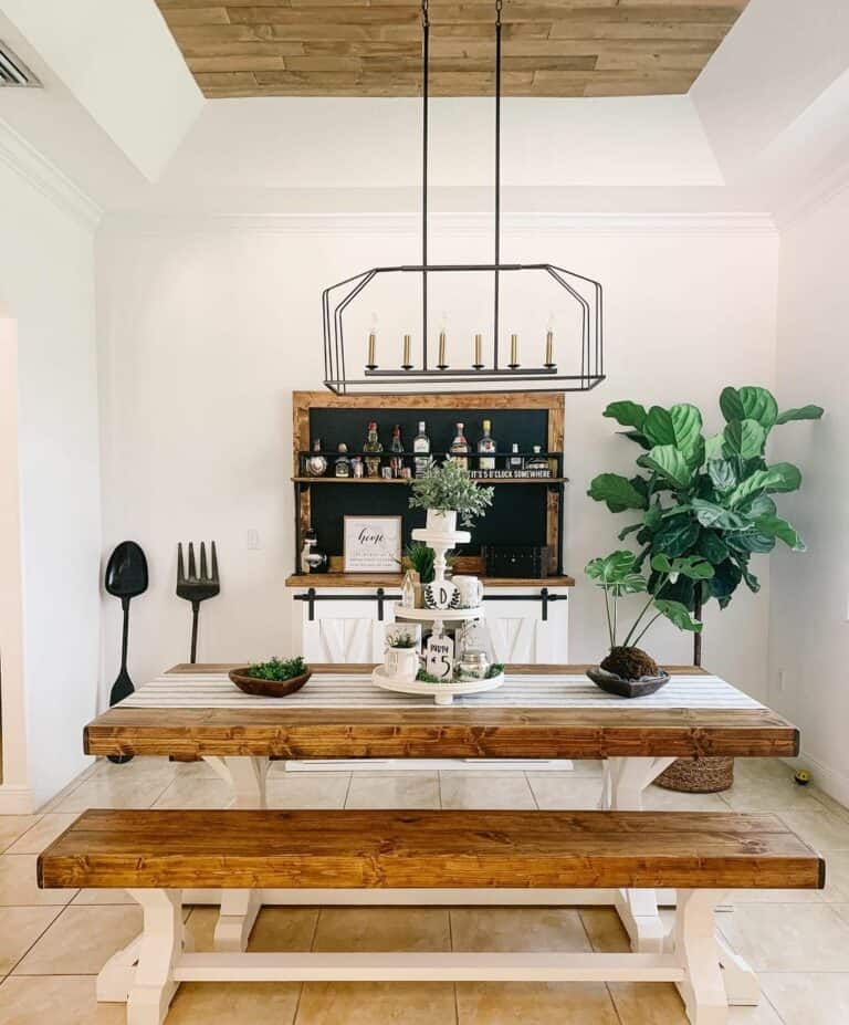 Black Lantern Chandelier Over Two-toned Wood Table