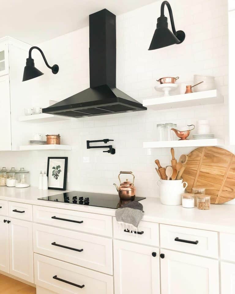 Black Pot Filler Among Kitchen Shelves