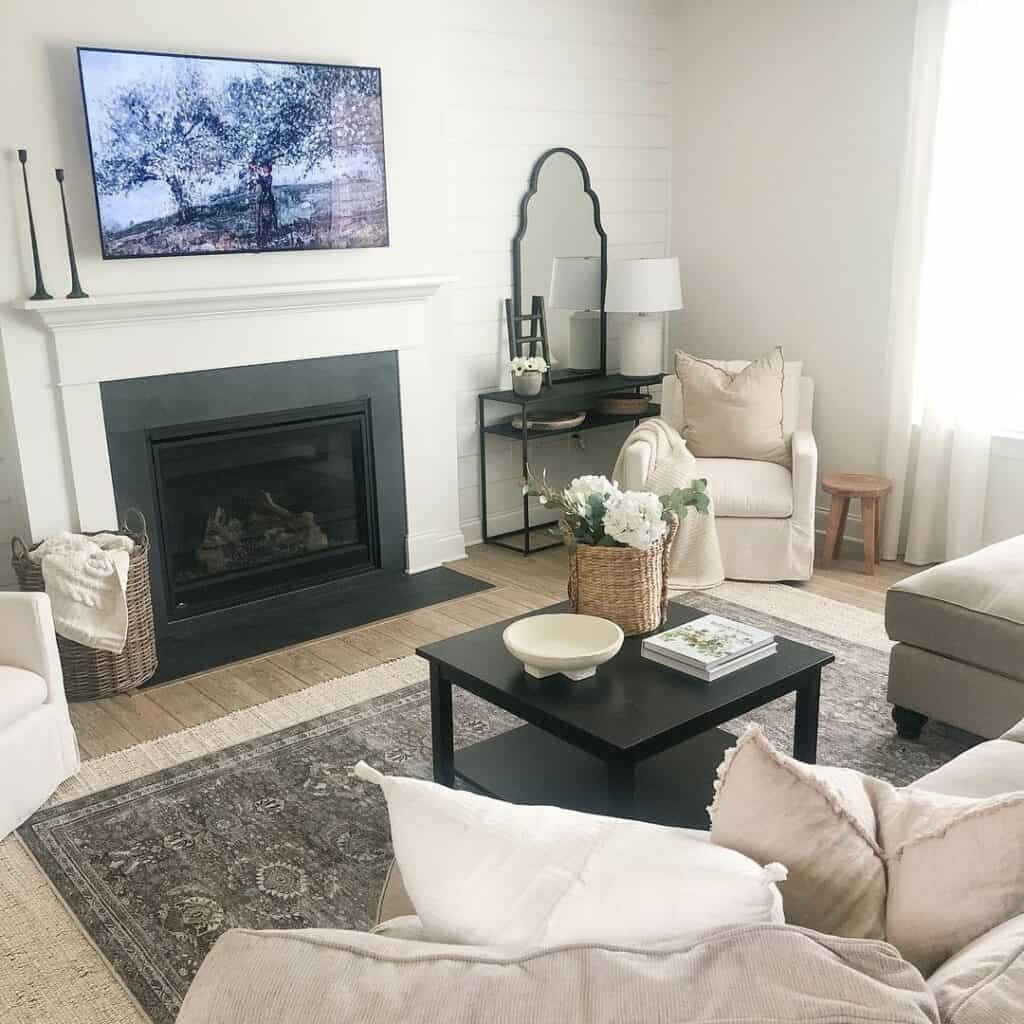 Black and Beige Living Room With Layered Rugs