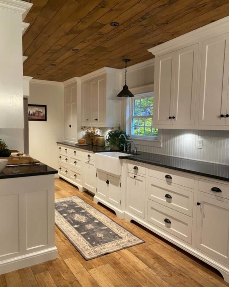 Black and White Kitchen With Wood Ceiling