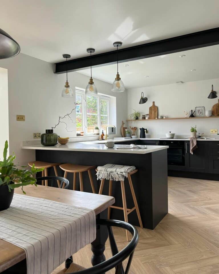 Black and White Themed Kitchen With Herringbone Wood Floor