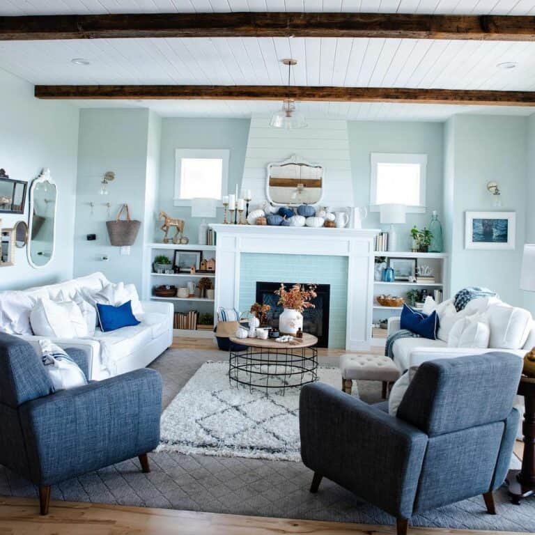 Blue and White Living Room With Layered Rugs