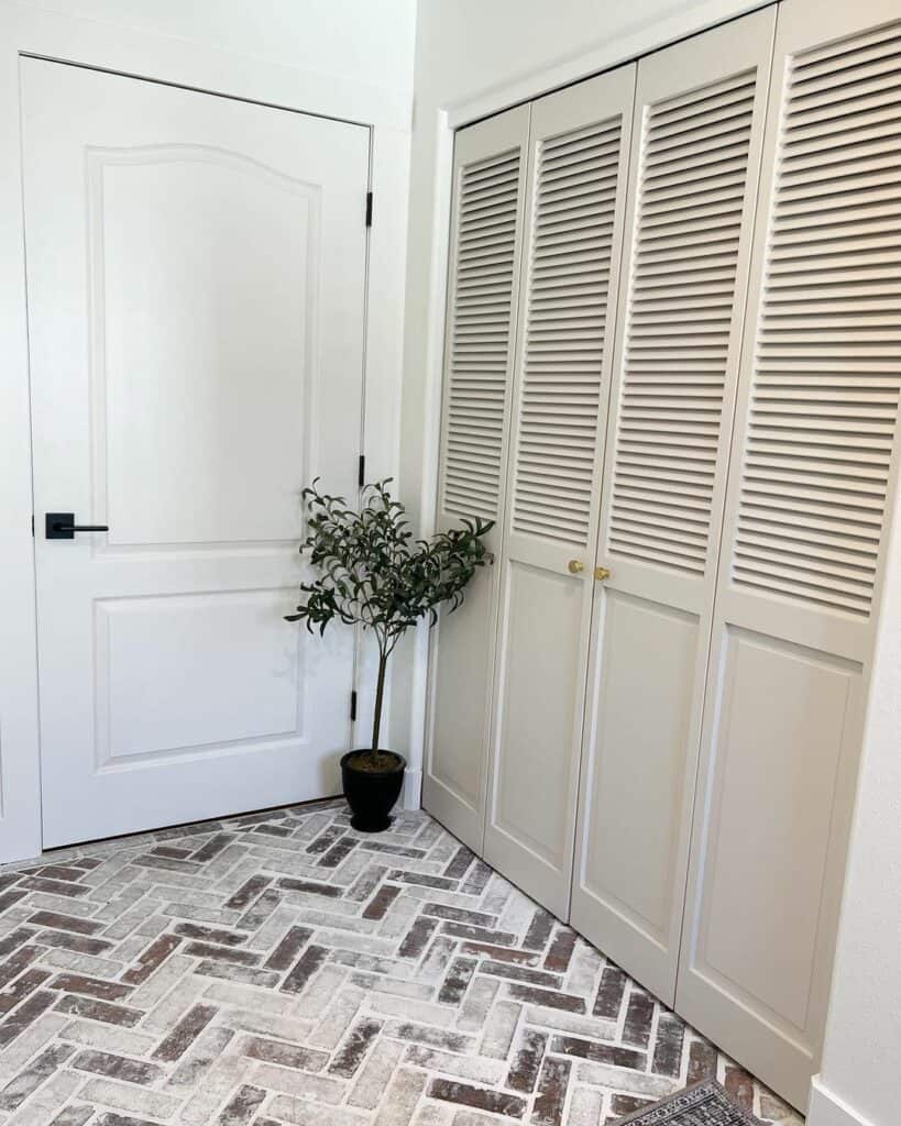 Brick Flooring and Beige Closet Doors