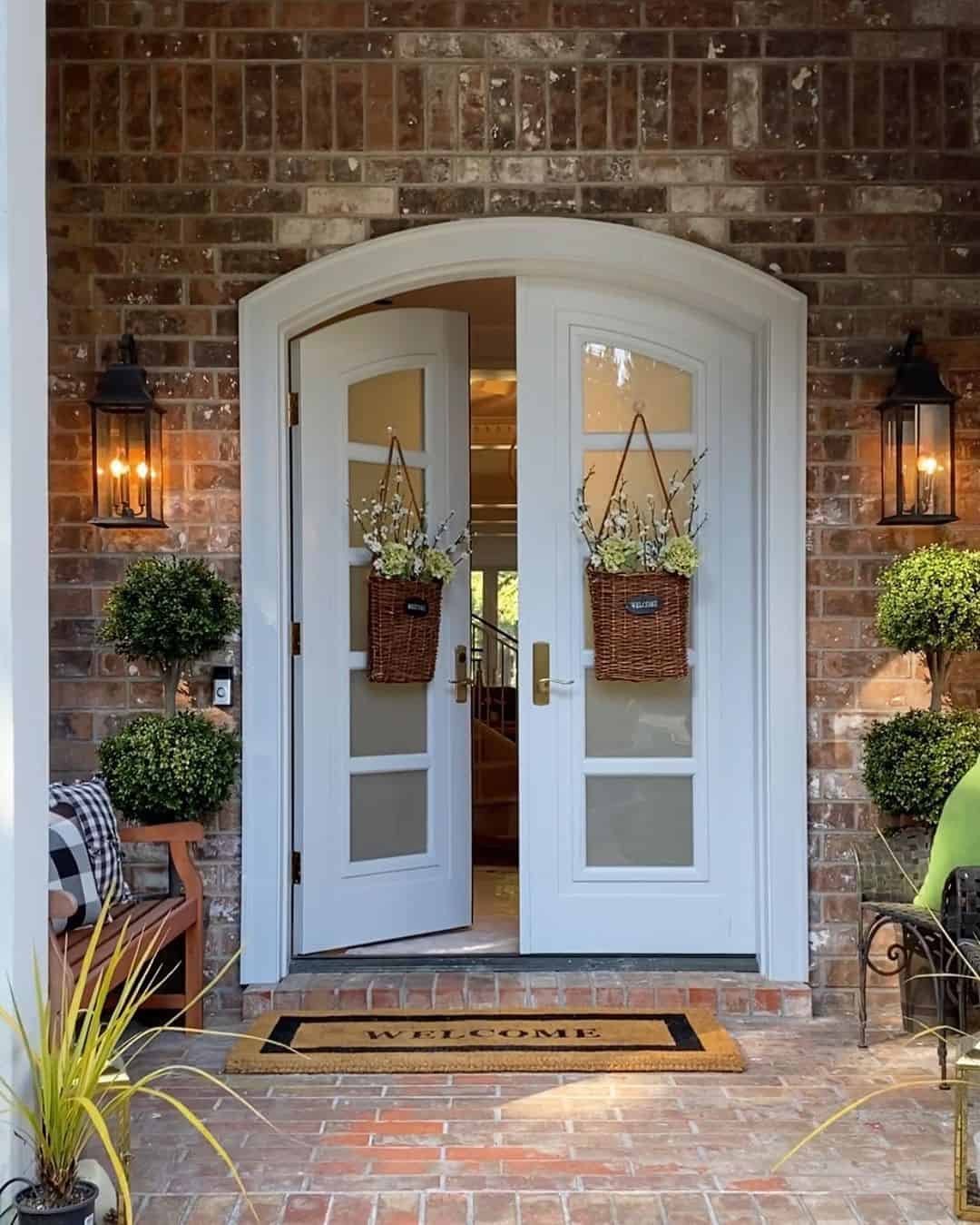 Brick home with white double front doors soul lane