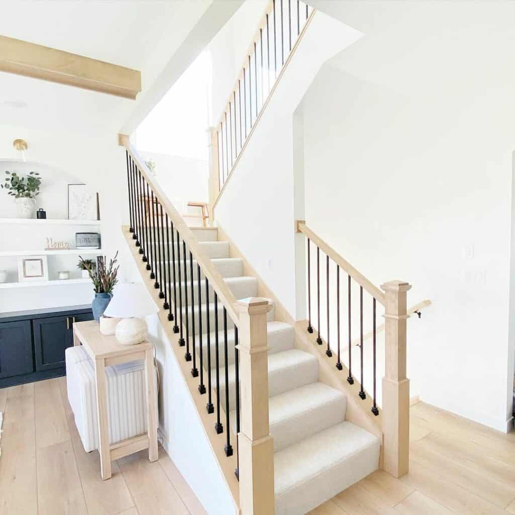 Bright and Modern Farmhouse Staircase With Black Balusters