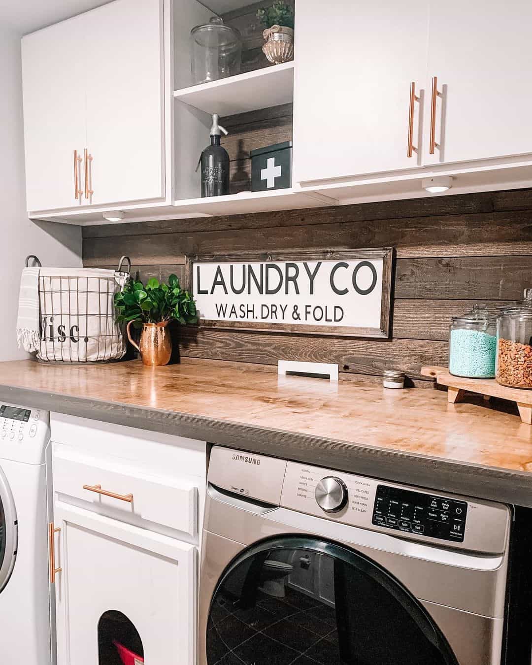 https://www.soulandlane.com/wp-content/uploads/2023/02/Built-in-Storage-Solutions-Between-a-Washer-and-Dryer.jpg