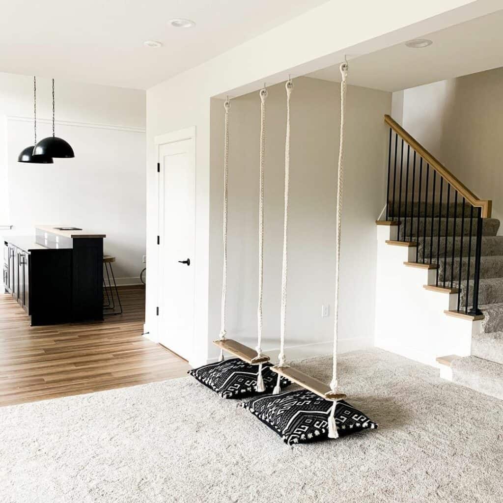 Carpeted Basement With Swings