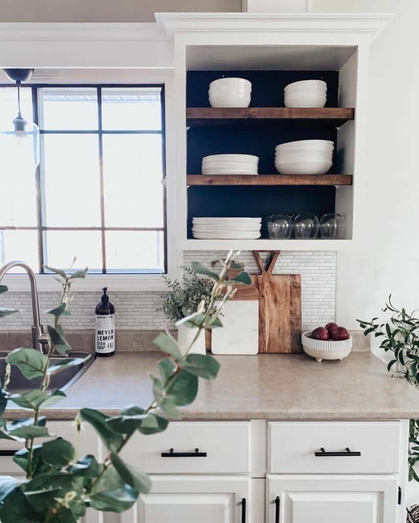 Chic White Kitchen With Green Plants