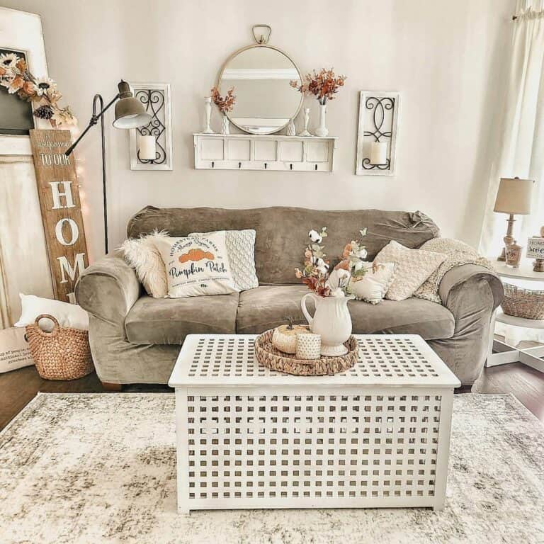 Circular Mirror Over Grey Sofa