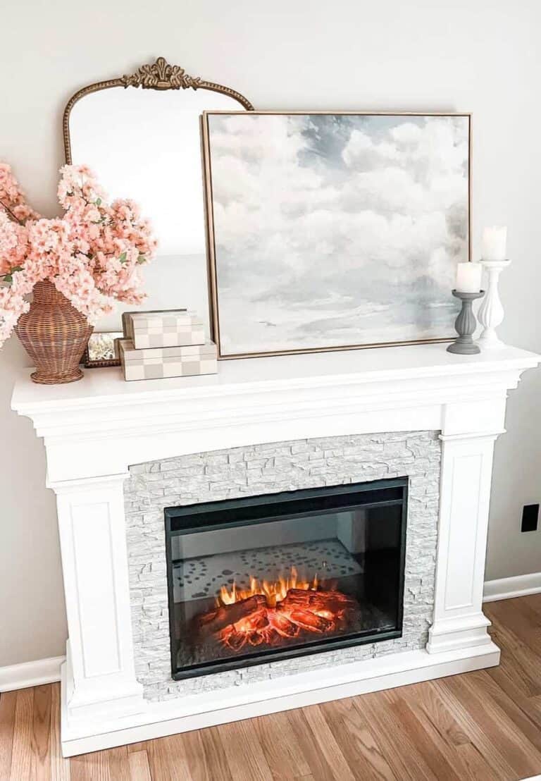 Cloud Print and Pink Flowers on a White Mantel
