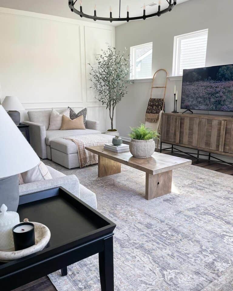 Coffee Table With Stone Vase and Stack of Books