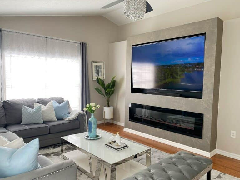 Coffee Table With White Flowers in Teal Vase