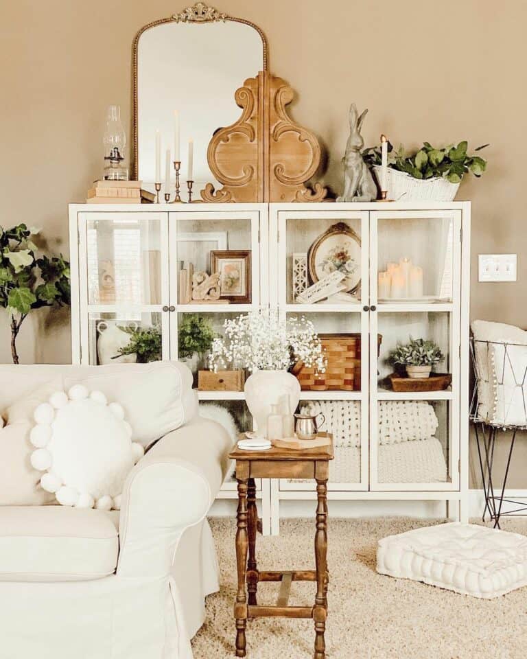 Collectibles in a White Display Cabinet With Glass Doors