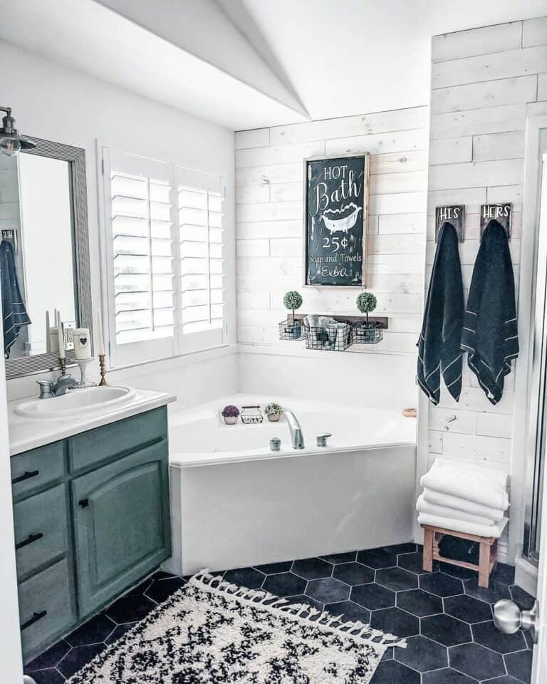 Corner Bathtub With Blue Vanity