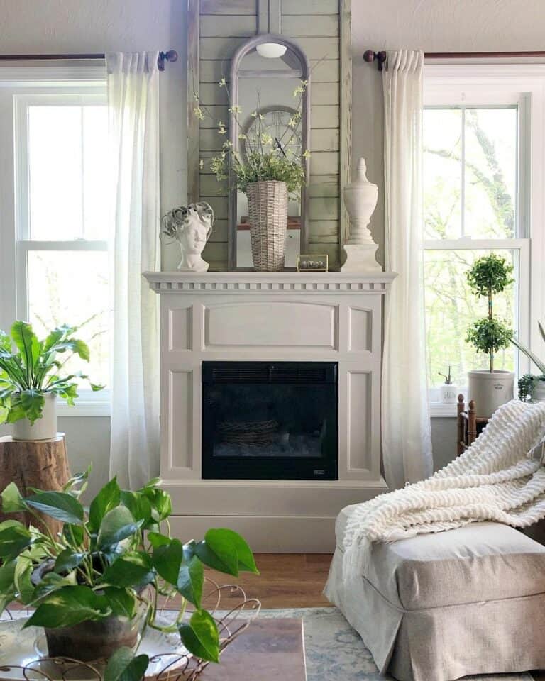 Cozy Living Room With White Fireplace